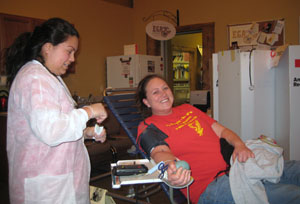 Marketing Coordinator donating blood